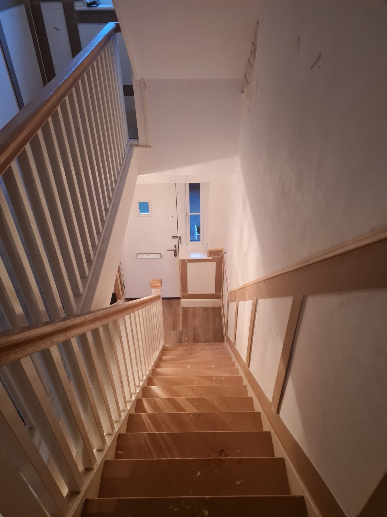 Staircase and panelling leading to the front door before painting, Abergele