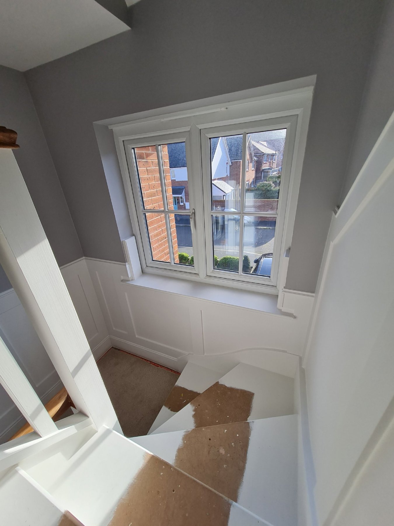 Painted window surround and panelling above the stairs, Abergele