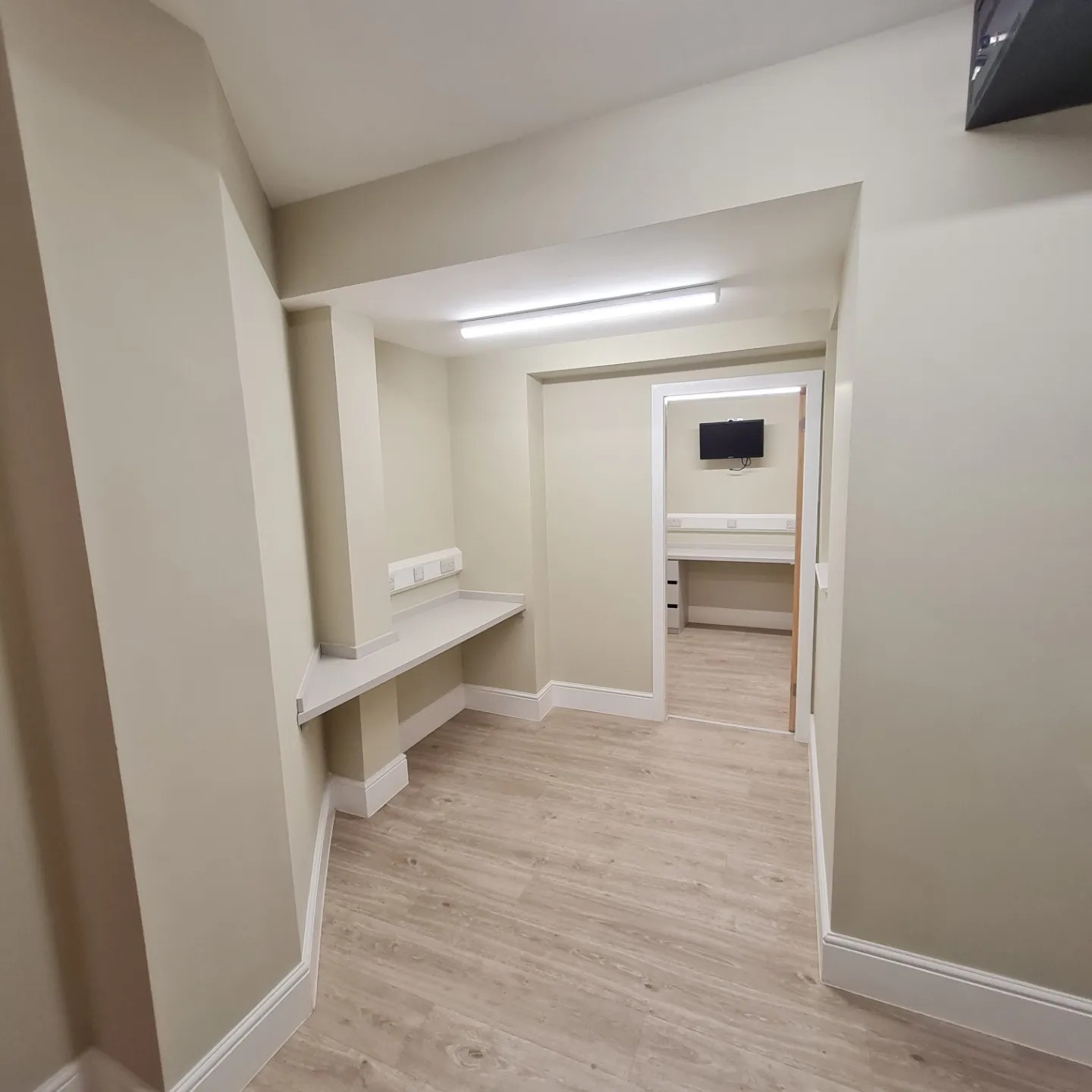 Painted office corridor with white skirting and door frames, Hillgrove House, Bangor