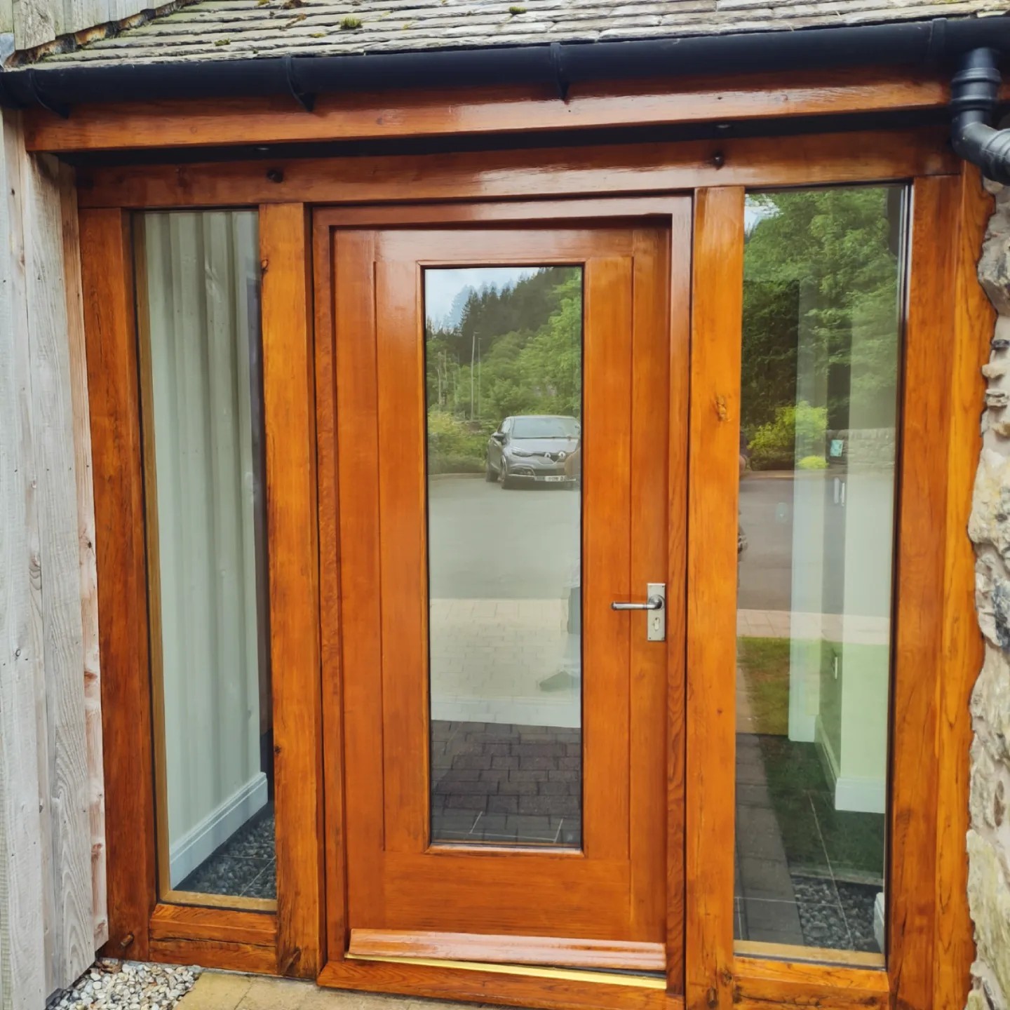 Finished oak porch entrance with glazed door at Hendre Rhys Gethin Lodges, Betws-y-Coed
