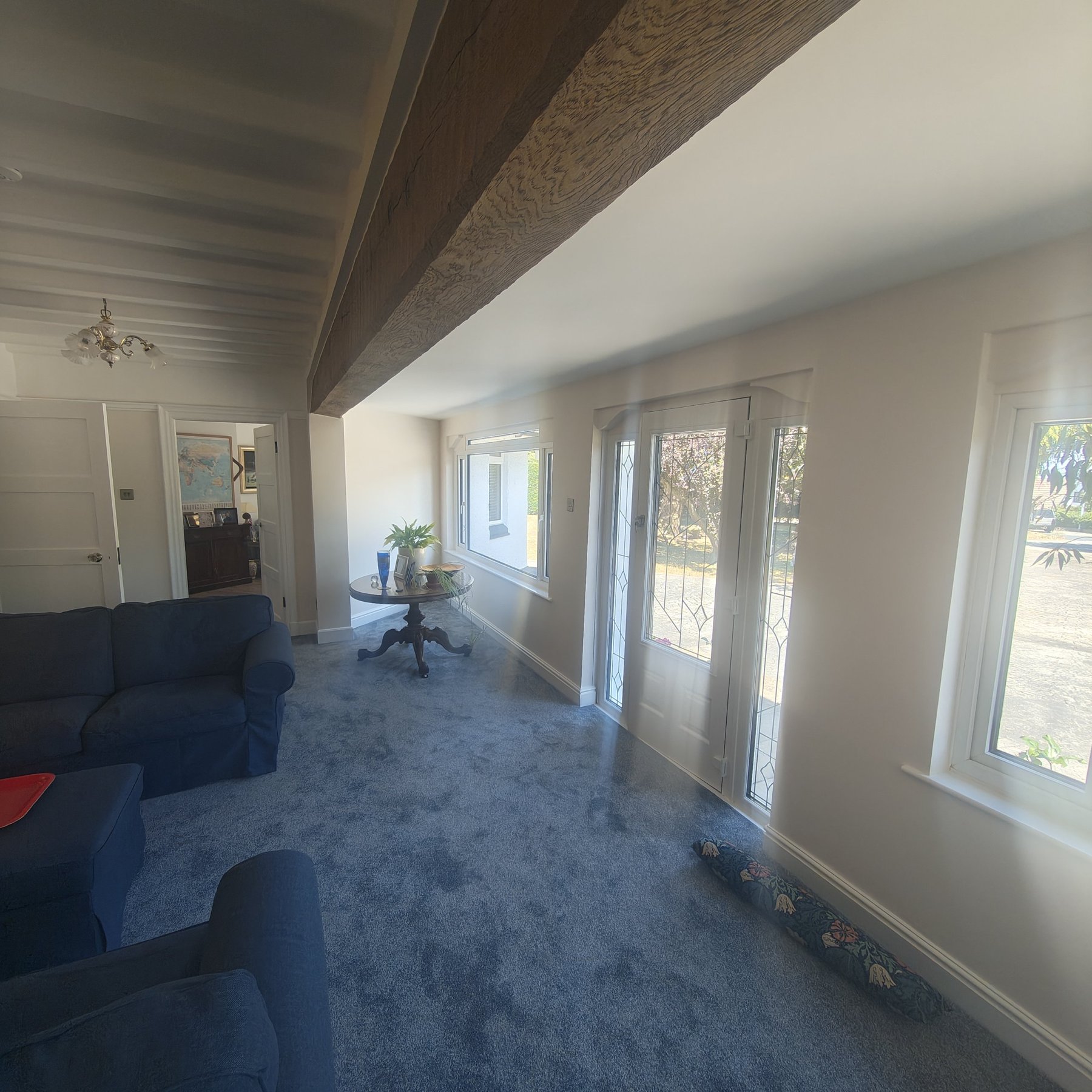 White painted ceiling beams and oak beam in reception room, Colwyn Bay