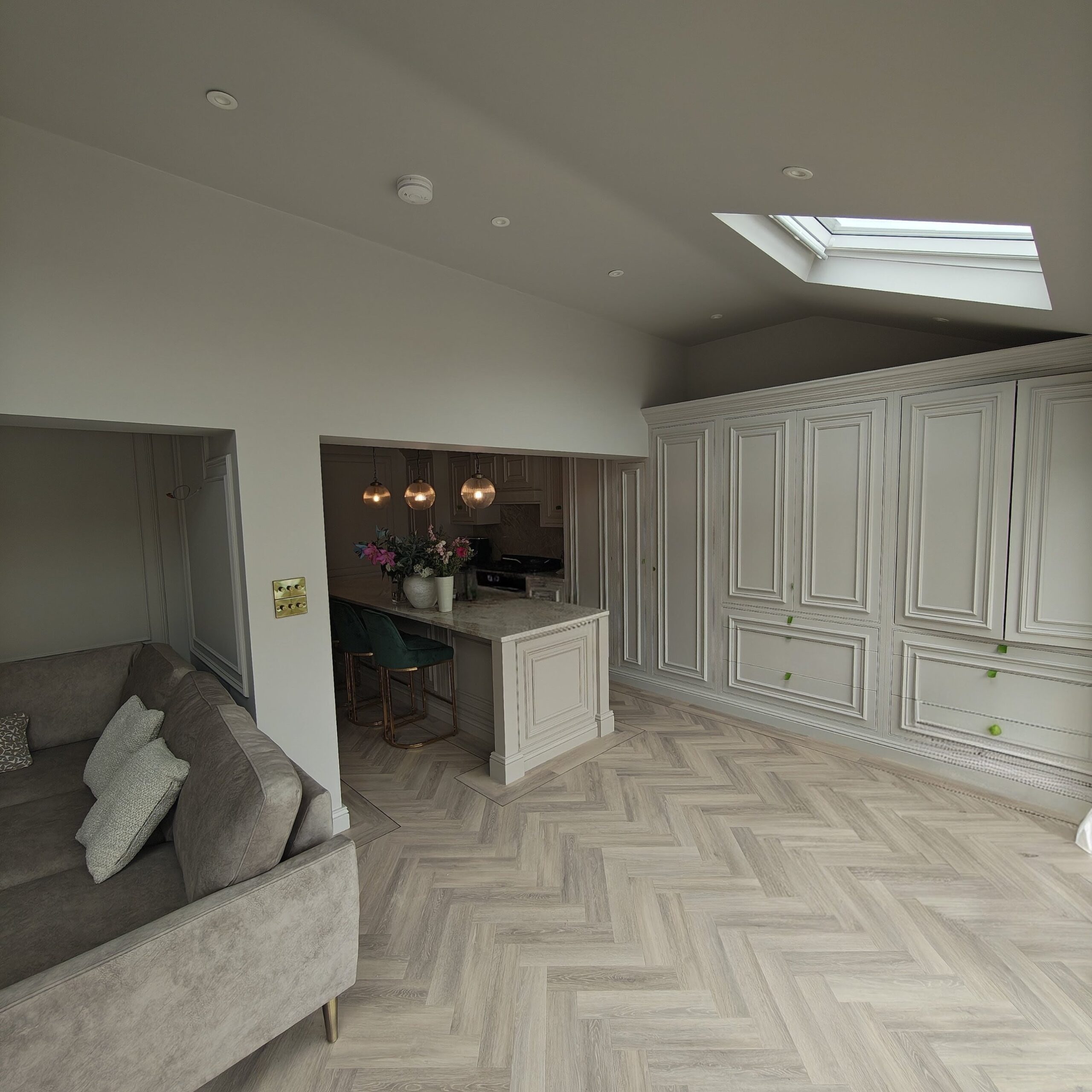 Painted bespoke cabinets and panelling in a Conwy kitchen diner
