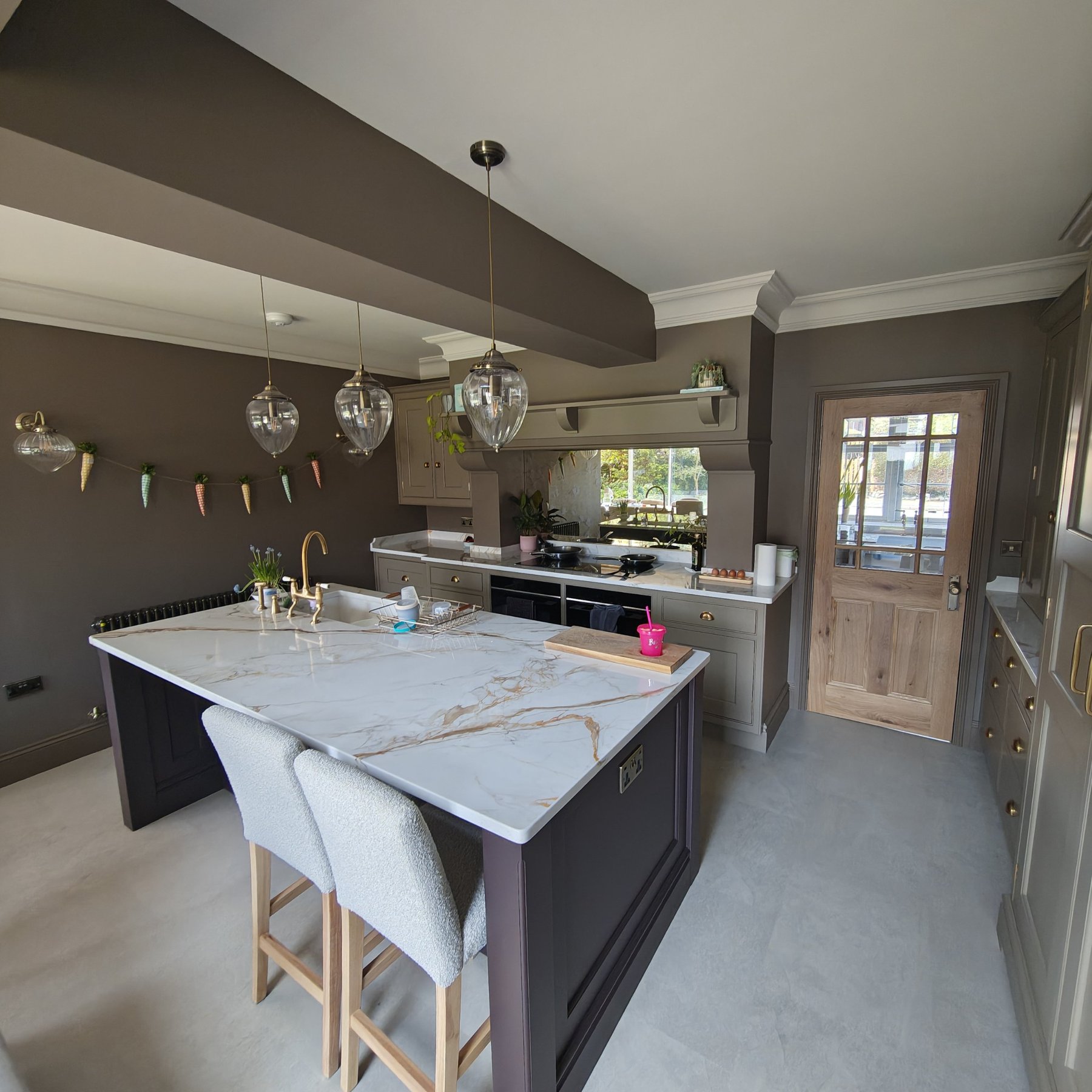 Finished kitchen with painted island, cabinets and oak glazed door, Penrhyn Bay