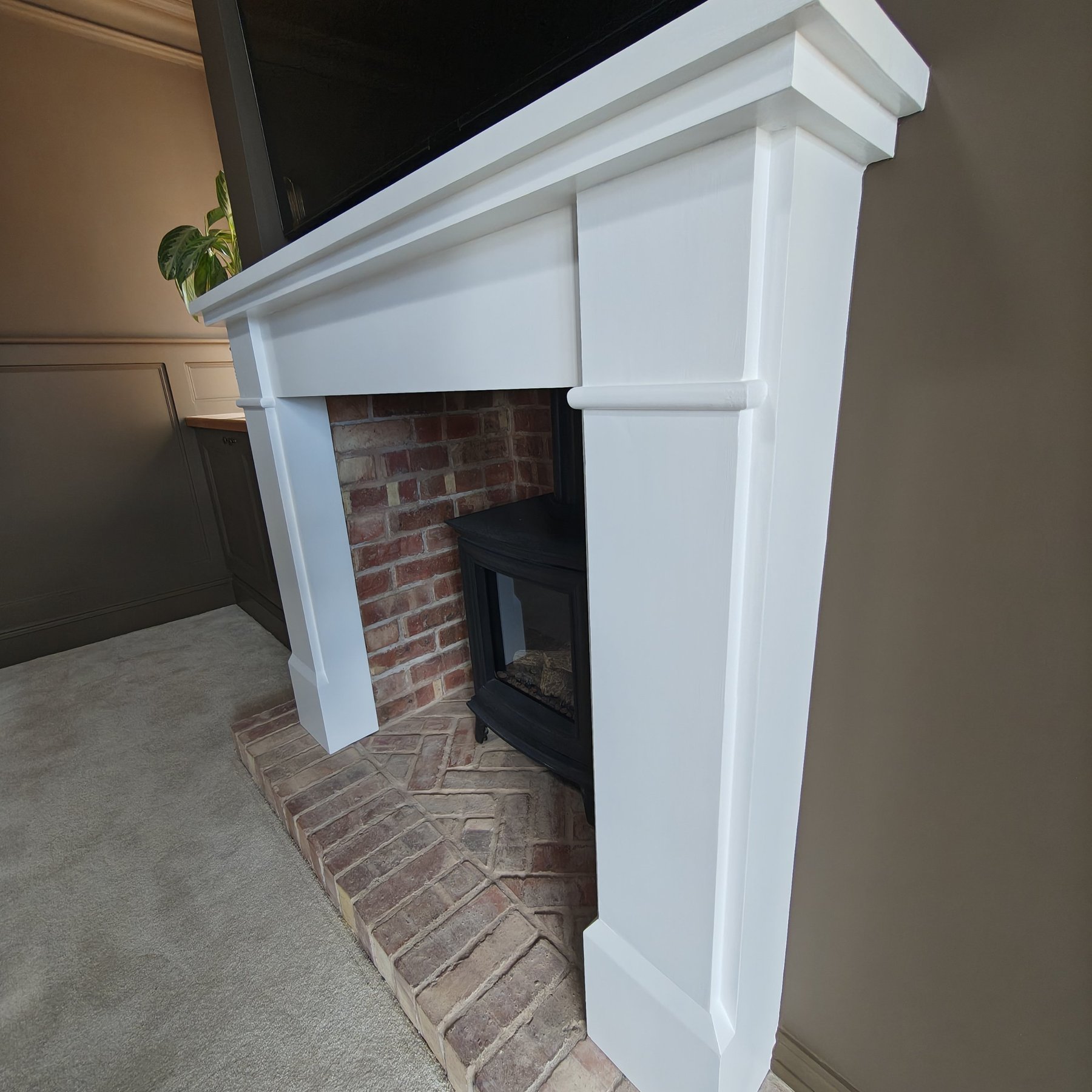 White painted fireplace surround with stove, Penrhyn Bay