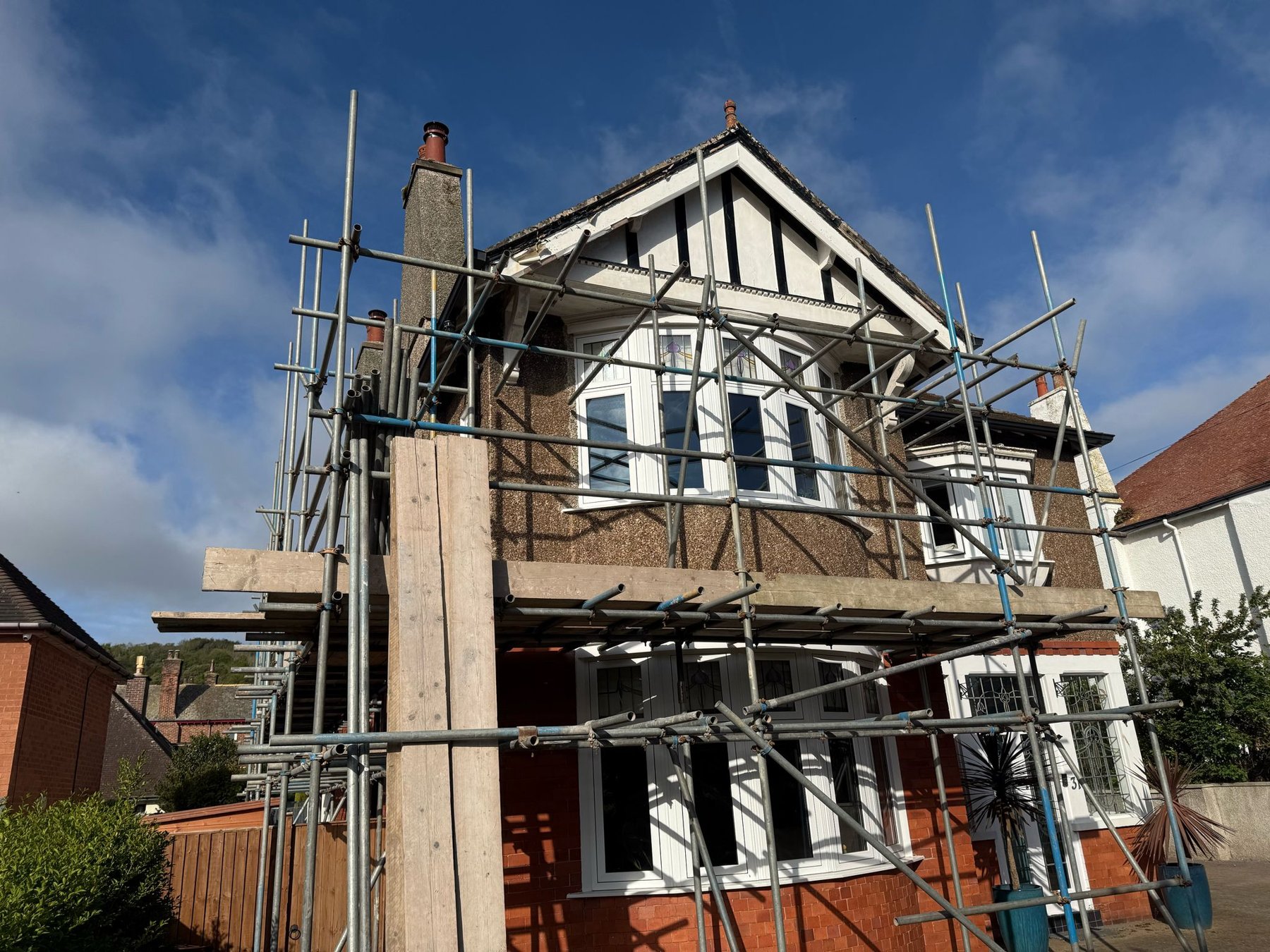 Scaffold up on the front of a Rhos on Sea house before exterior decorating