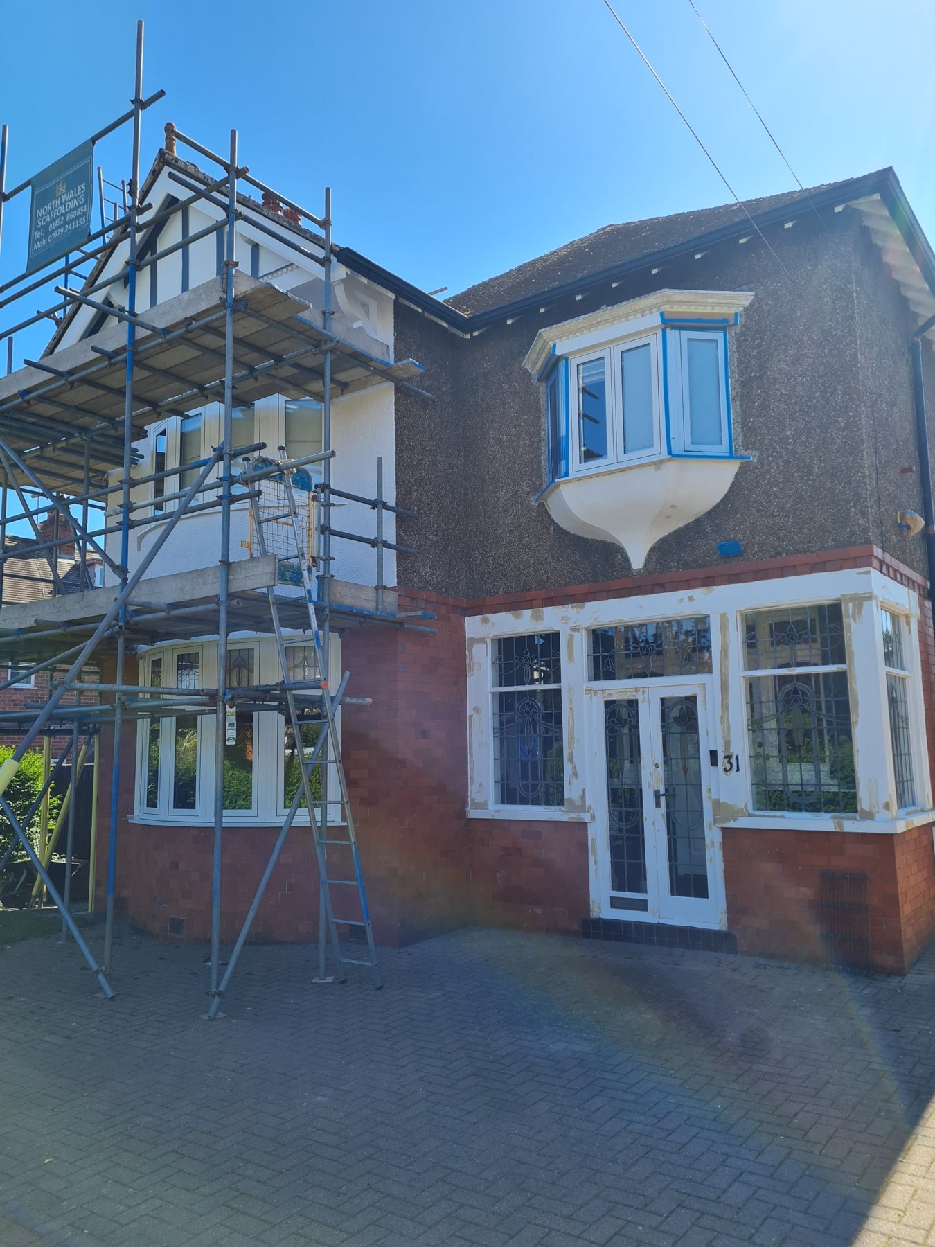 Scaffold up on the side of a Rhos on Sea house before exterior decorating