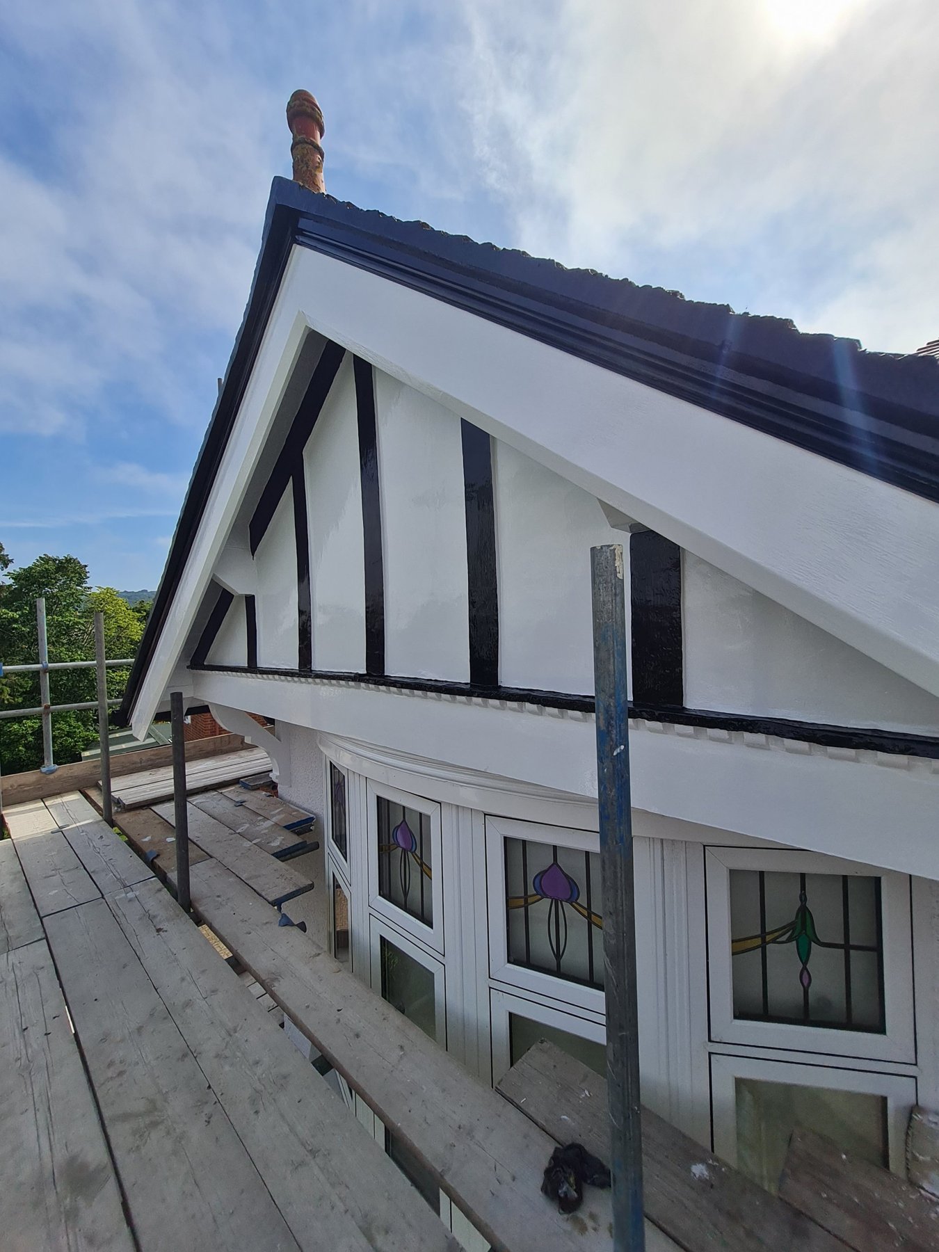 Painted gable timbers, bargeboards and brackets above the bay window, Rhos on Sea