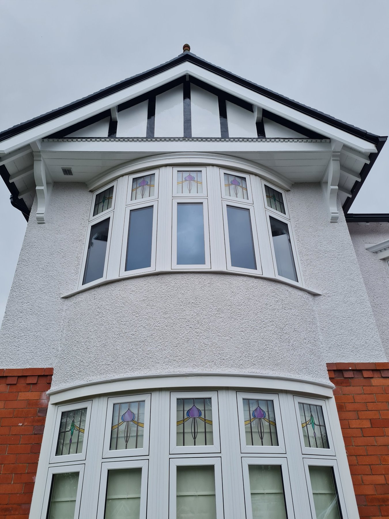 Painted gable and curved bay window, exterior decorating in Rhos on Sea