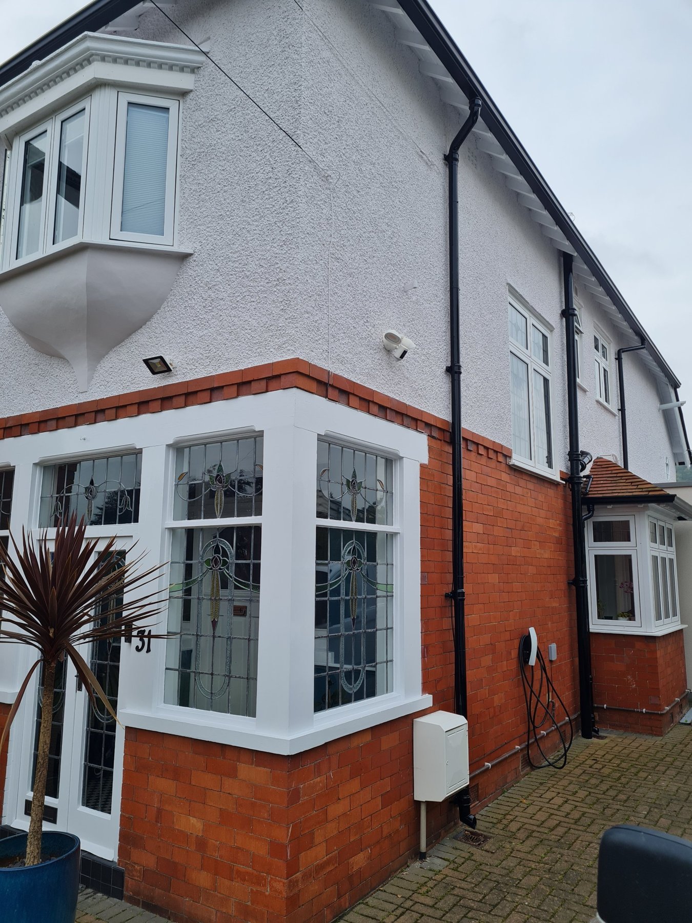 Side of the house with painted walls and bay window, Rhos on Sea