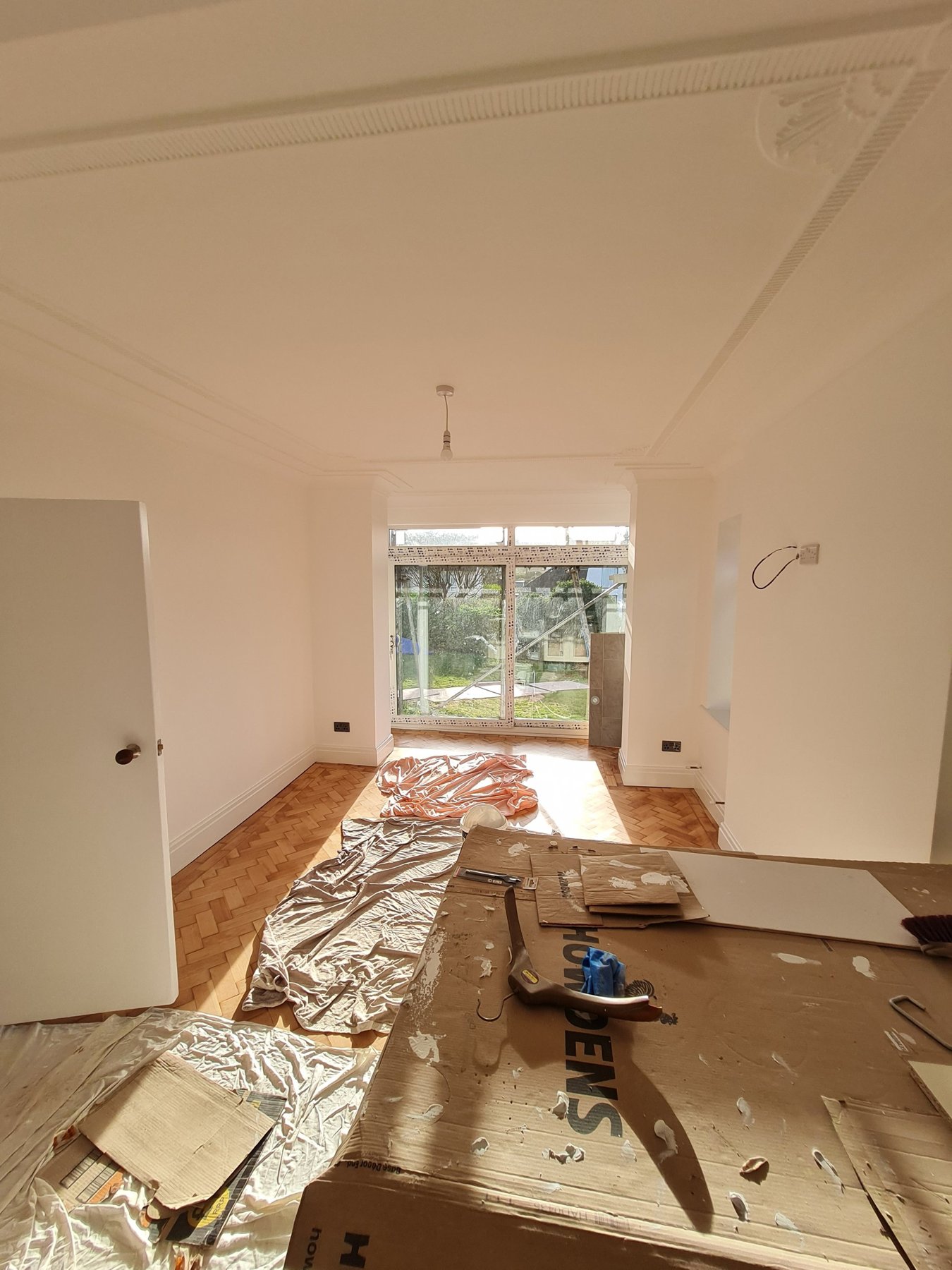 Painted ceiling cornice and ceiling rose above parquet floor, Rhyl